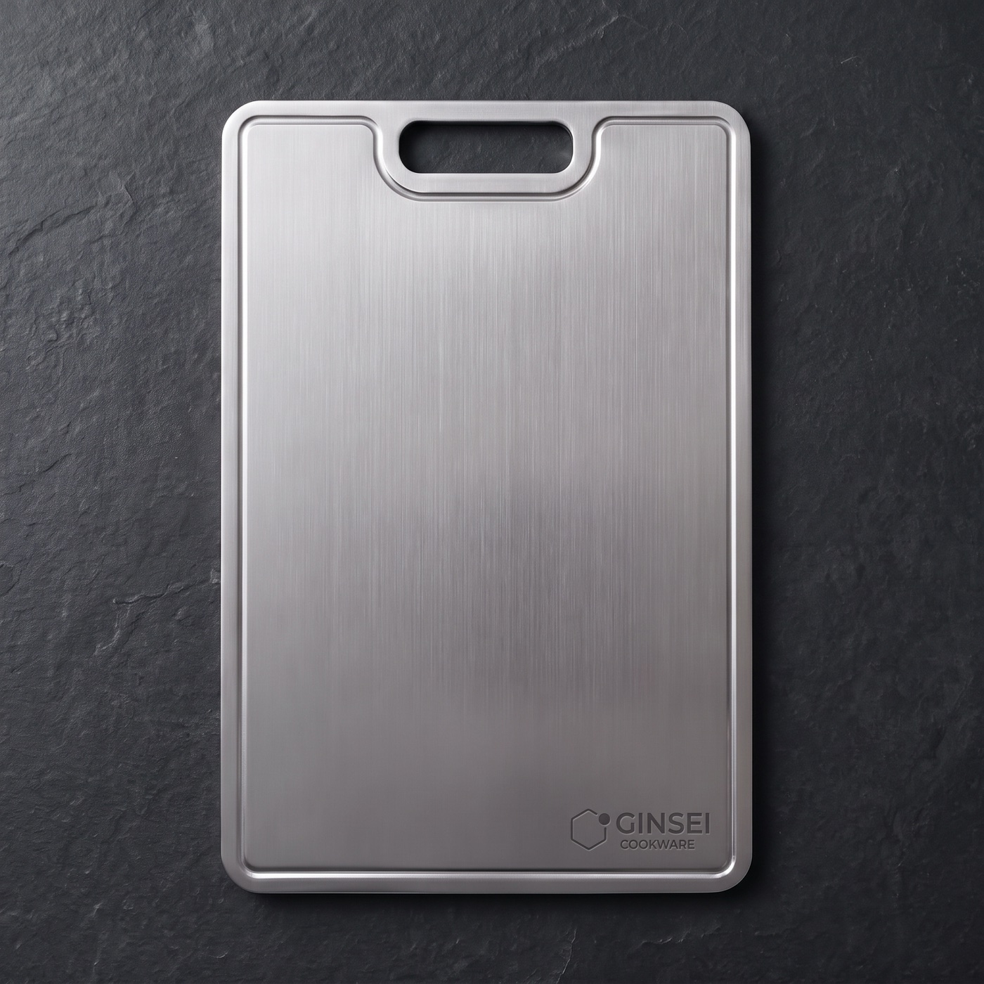 A pristine GINSEI titanium cutting board, seen from above